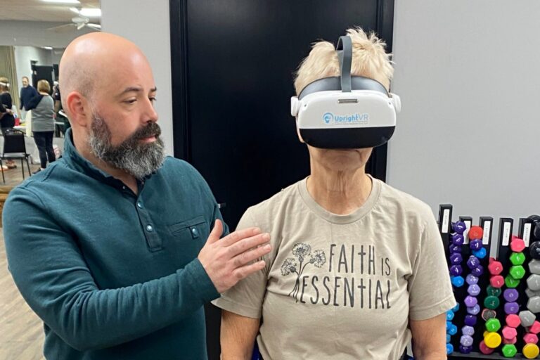 Patient using a VR rehabilitation headset during balance therapy